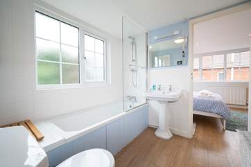 The Jack and Jill bathroom on the first floor provides a shower over the bath.