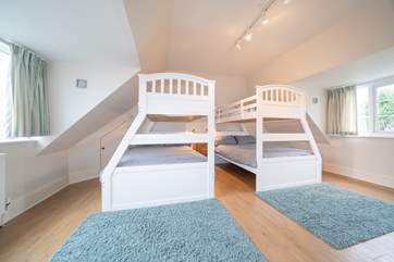 The family bedroom on the first floor offering flexible sleeping quarters that would suit adults and children alike...