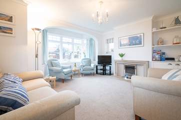 One of two pleasant sitting-rooms that offer ample space for the entire family.