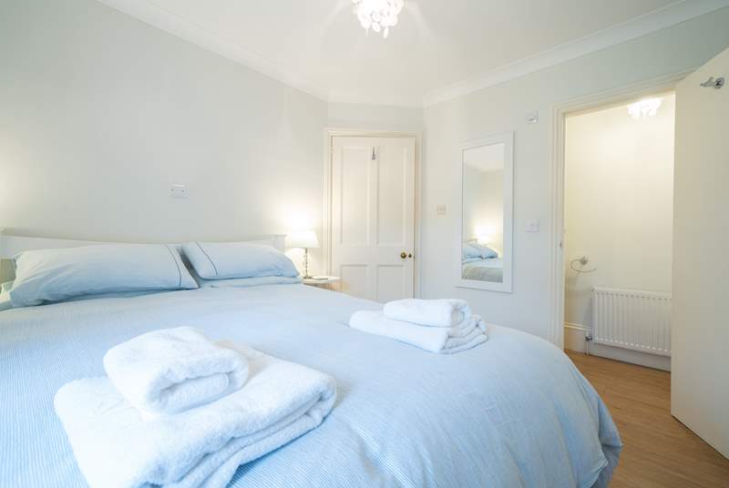 The ground floor bedroom is spacious and bright, offering the added convenience of an en suite cloakroom.