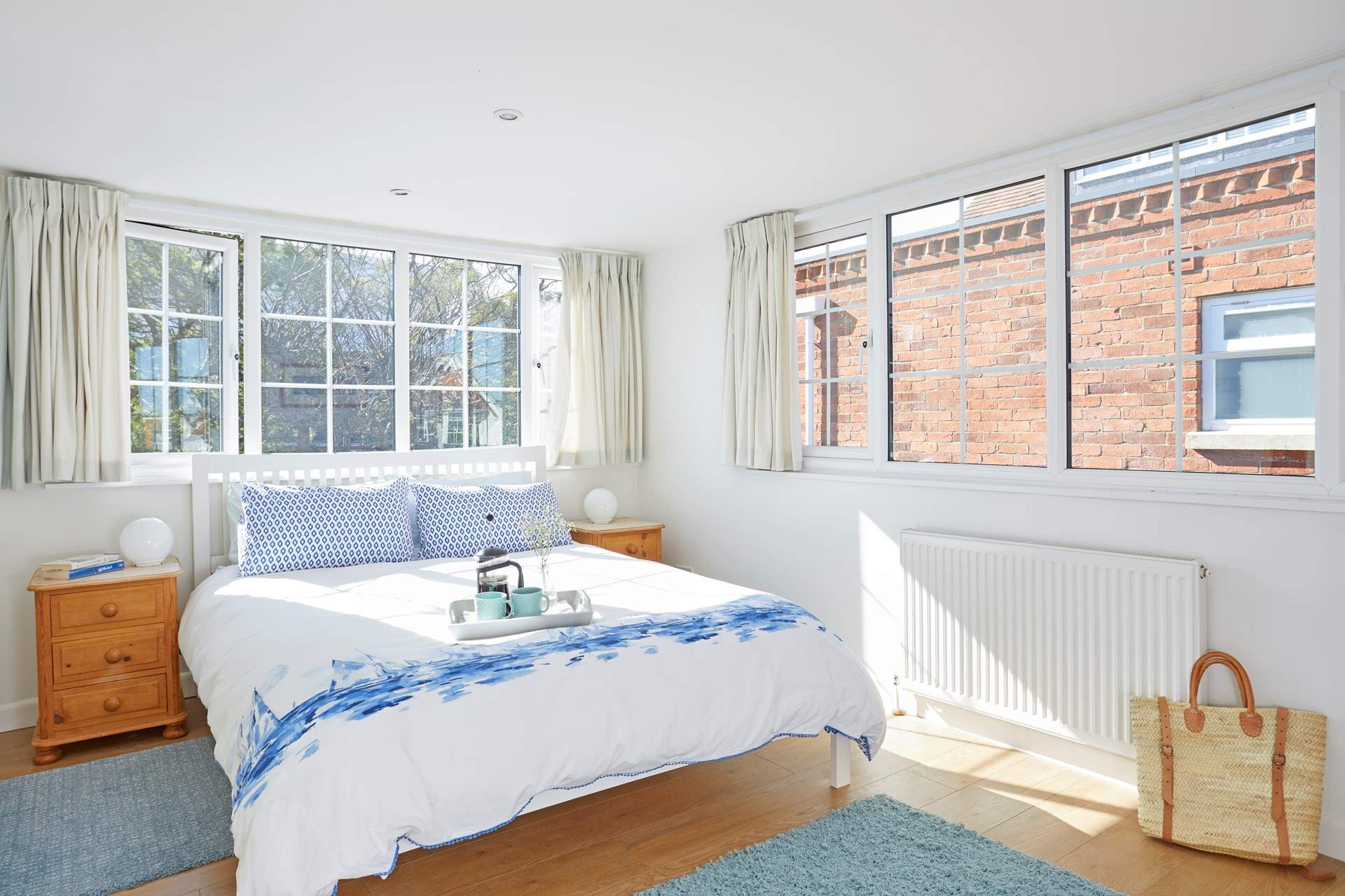 The first floor double bedroom overlooks the pretty private garden.