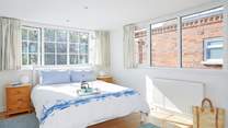 The first floor double bedroom overlooks the pretty private garden.