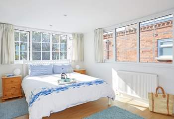 The first floor double bedroom overlooks the pretty private garden.