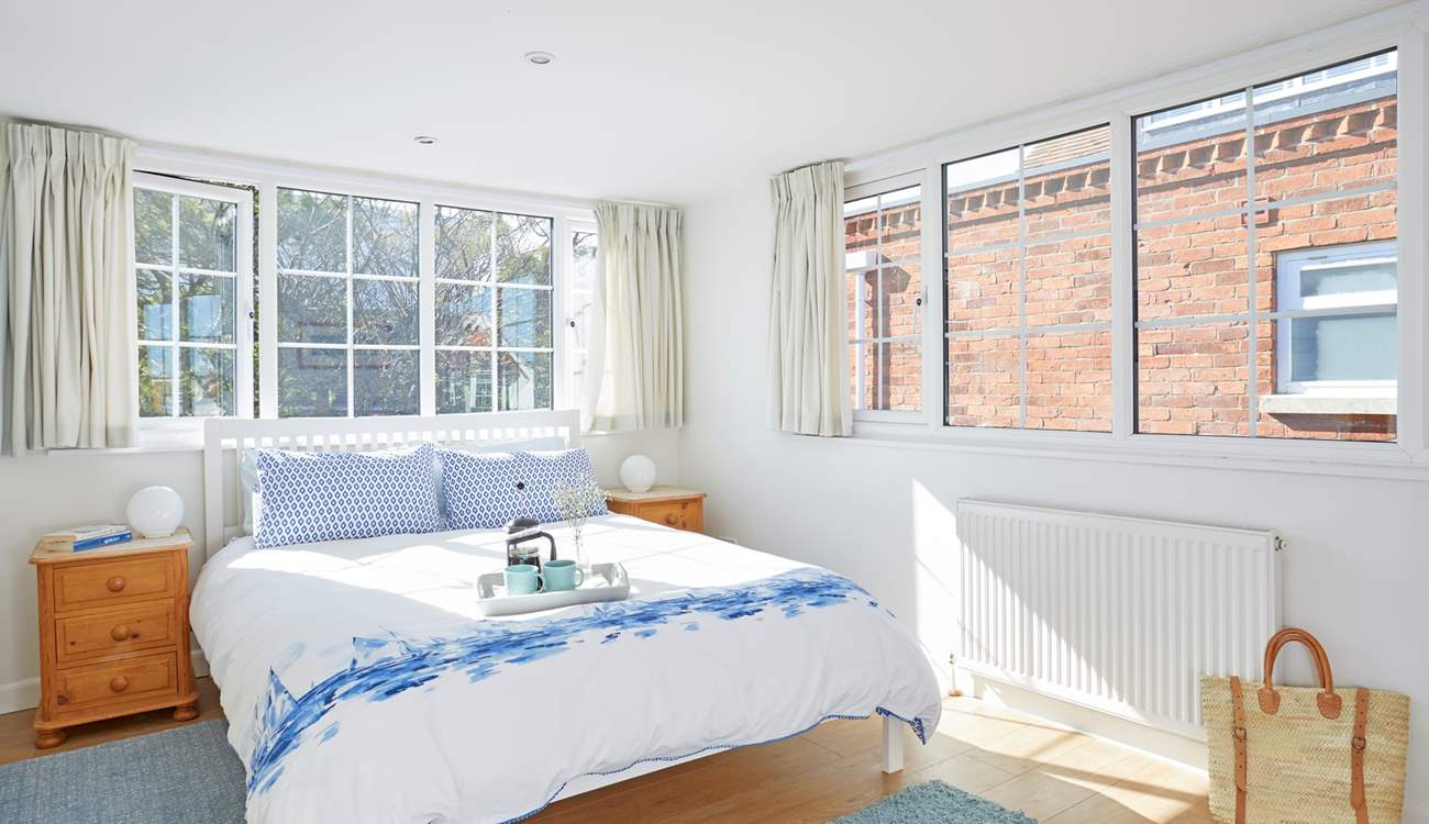 The first floor double bedroom overlooks the pretty private garden.