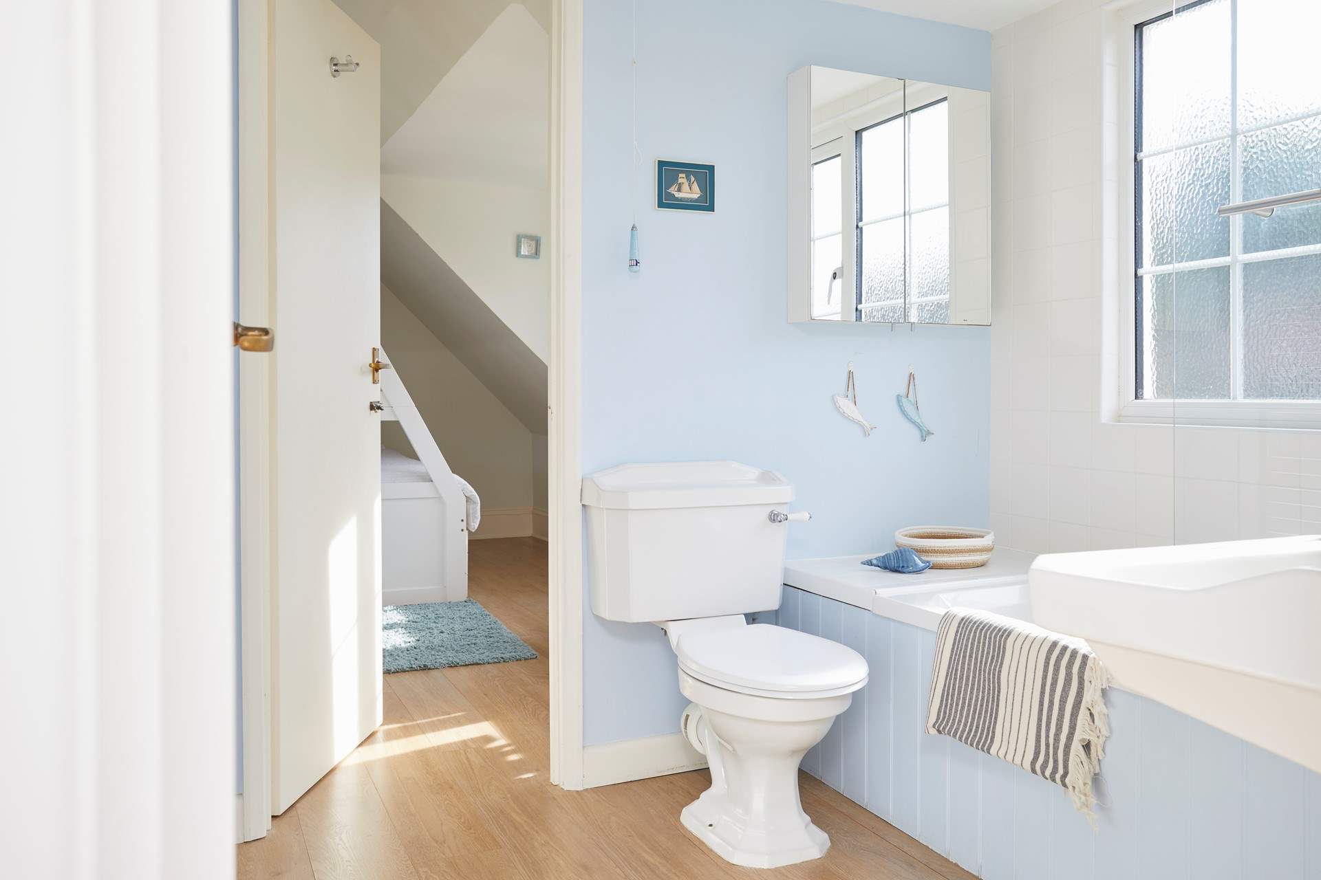 A beautifully designed bathroom, connecting with both first-floor bedrooms. 