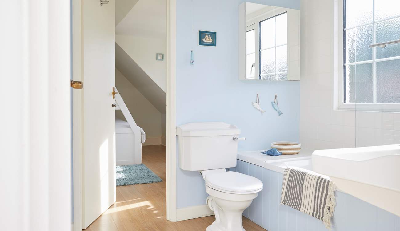 A beautifully designed bathroom, connecting with both first-floor bedrooms. 