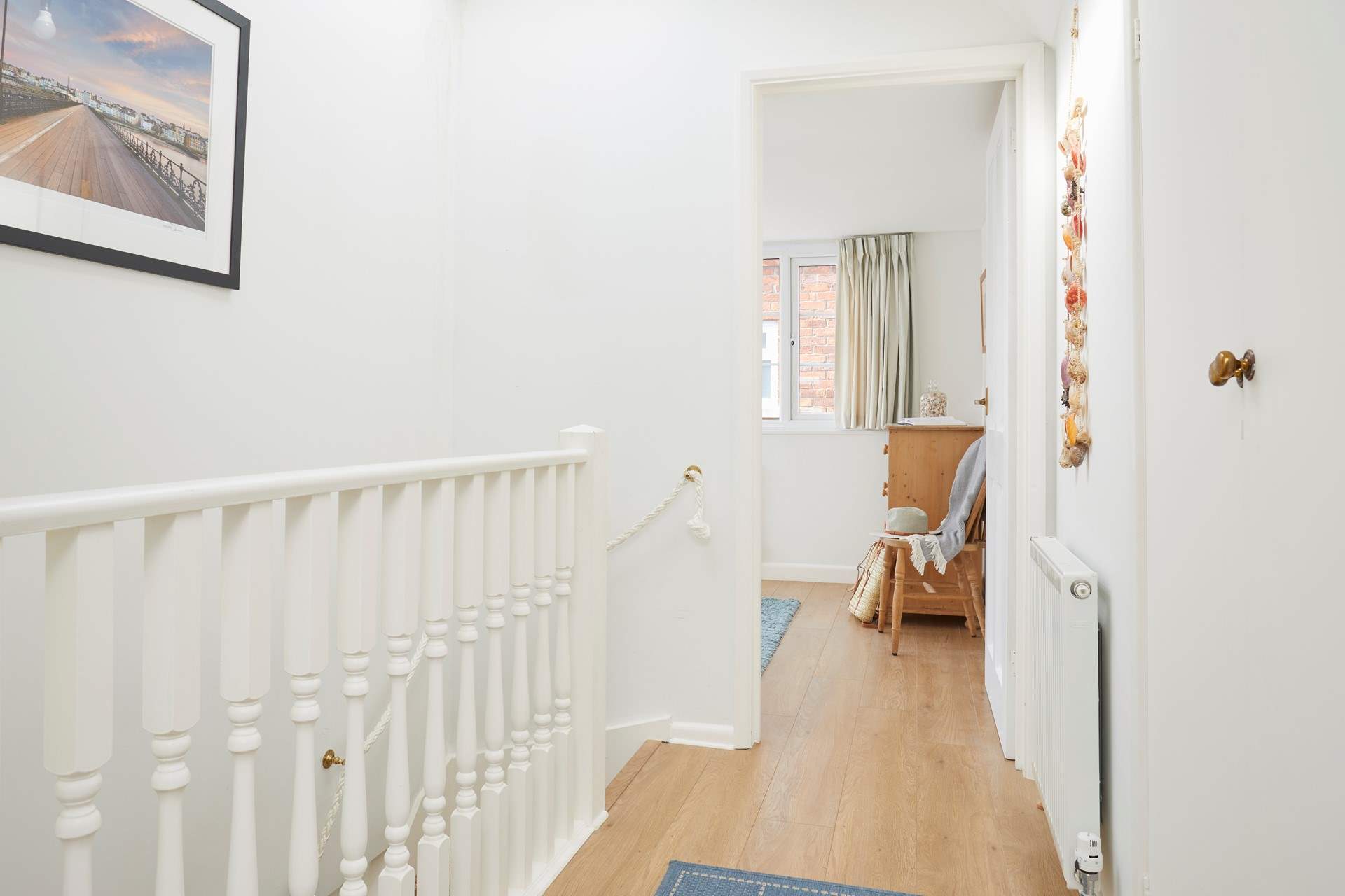 The first-floor landing is bathed in natural light.
