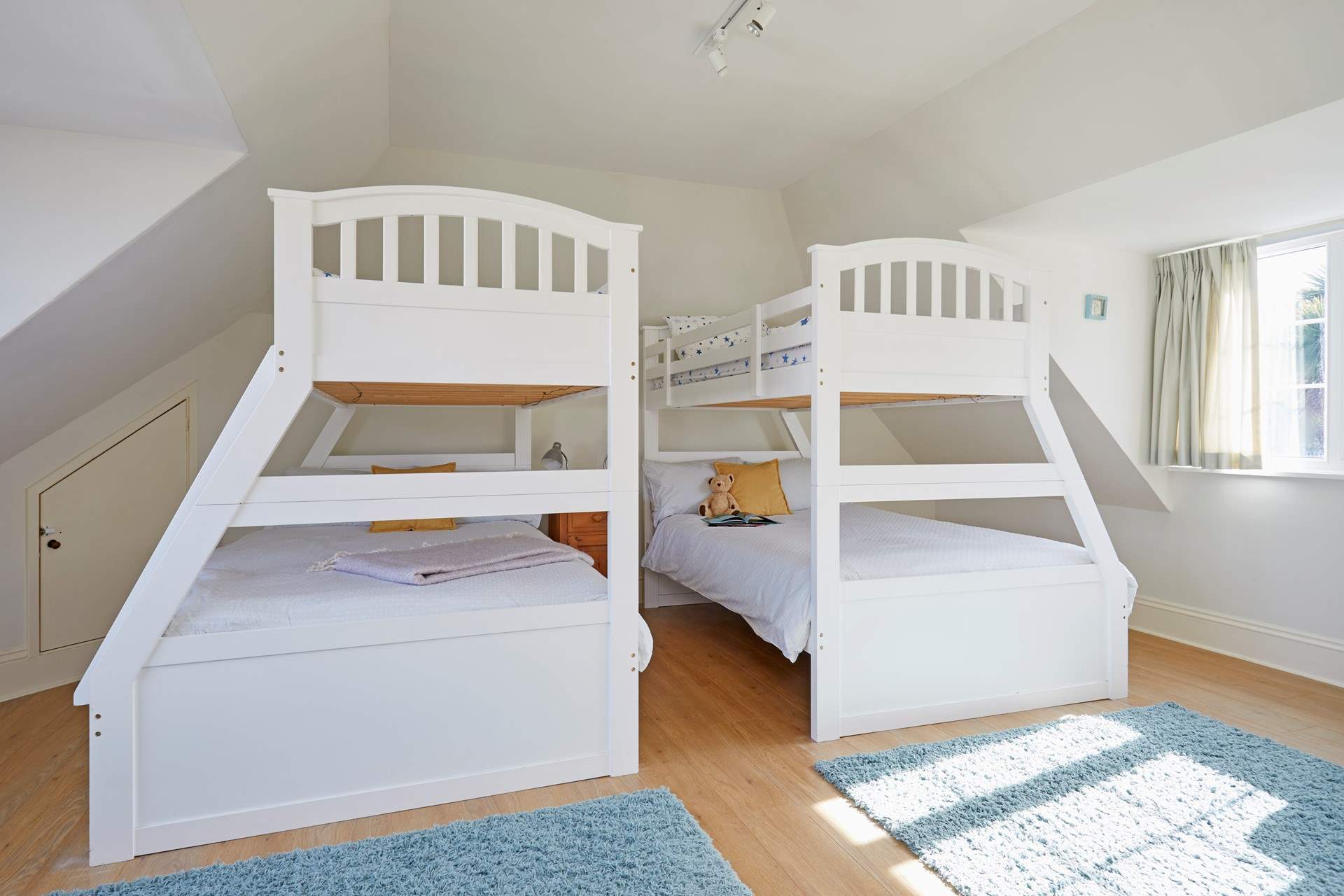 The family bedroom on the first floor offering flexible sleeping quarters that would suit adults and children alike...