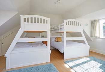 The family bedroom on the first floor offering flexible sleeping quarters that would suit adults and children alike...