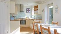 The kitchen/dining-room opens out to a lovely private enclosed garden.