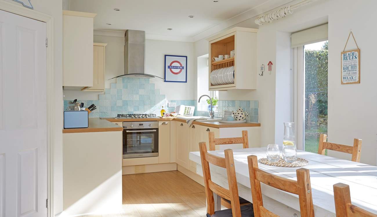 The kitchen/dining-room opens out to a lovely private enclosed garden.