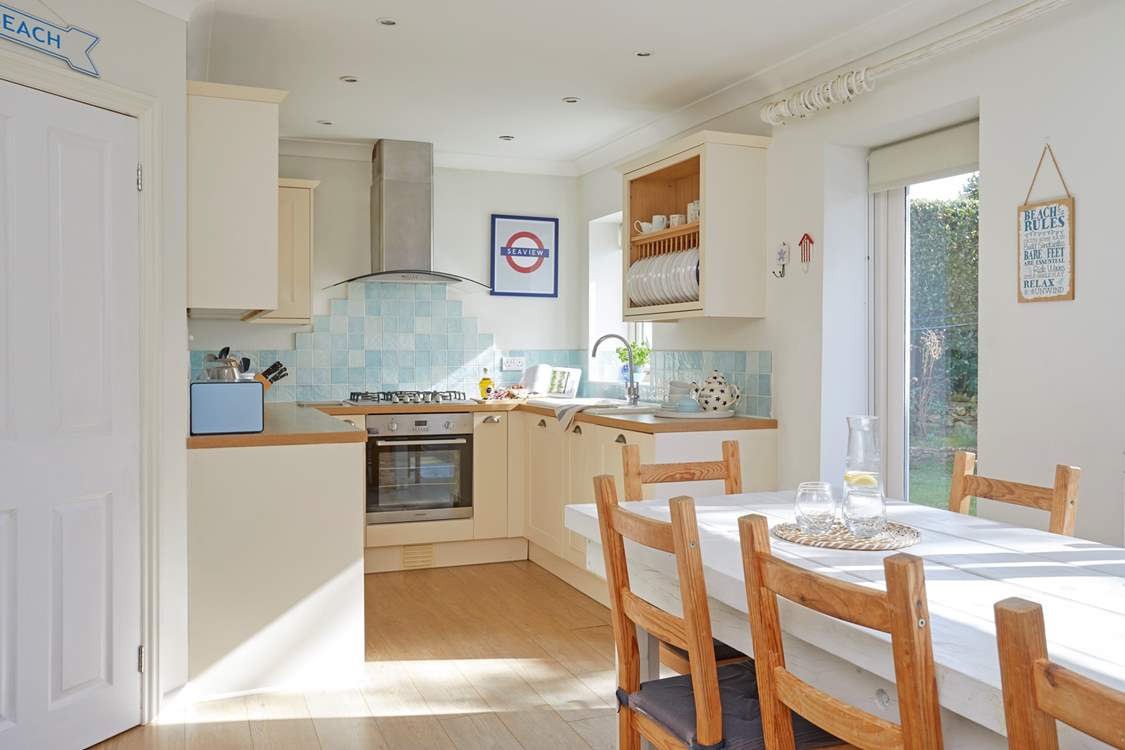 The kitchen/dining-room opens out to a lovely private enclosed garden.
