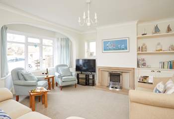 One of two pleasant sitting-rooms that offer ample space for the entire family.