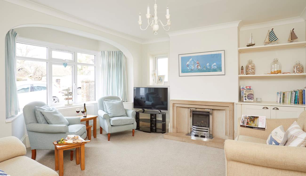 One of two pleasant sitting-rooms that offer ample space for the entire family.