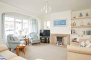One of two pleasant sitting-rooms that offer ample space for the entire family.