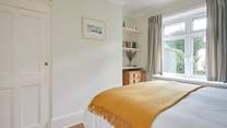 Complete with an en suite cloakroom, the ground floor bedroom is spacious and bright.