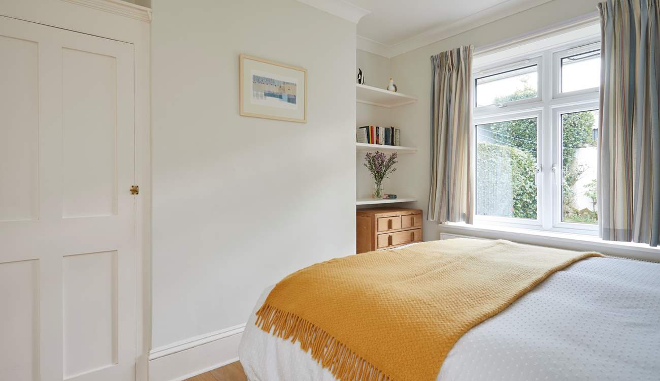 Complete with an en suite cloakroom, the ground floor bedroom is spacious and bright.