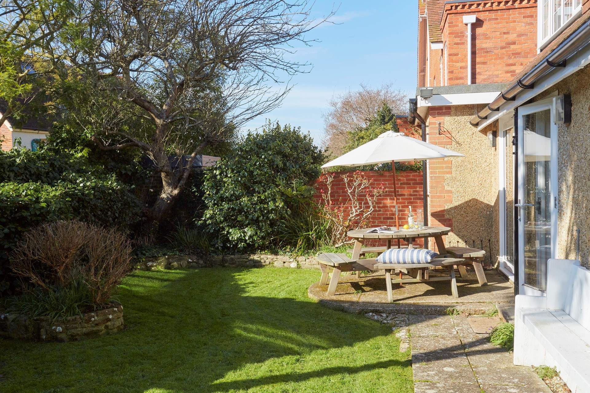 The leafy private garden is fully enclosed, ideal for active young children and pets.