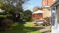 The leafy private garden is fully enclosed, ideal for active young children and pets.