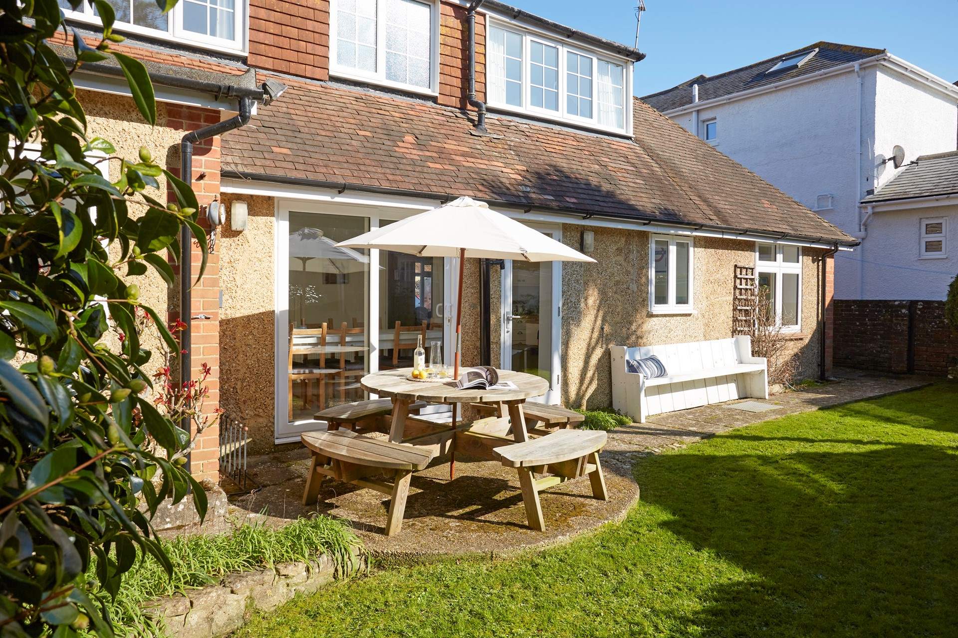 The enclosed garden to the rear of the property is a lovely private spot for enjoying the sunshine with family and friends.