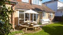 The enclosed garden to the rear of the property is a lovely private spot for enjoying the sunshine with family and friends.