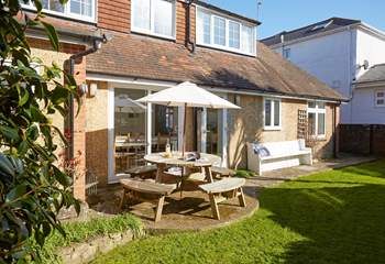 The enclosed garden to the rear of the property is a lovely private spot for enjoying the sunshine with family and friends.