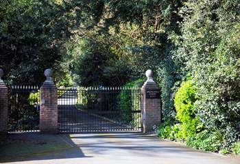 The picturesque drive through the grounds and up to the property starts at the automatic gates.