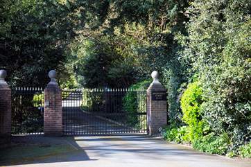 The picturesque drive through the grounds and up to the property starts at the automatic gates.