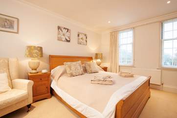 Relax and get a peaceful night's sleep in the spacious master bedroom.