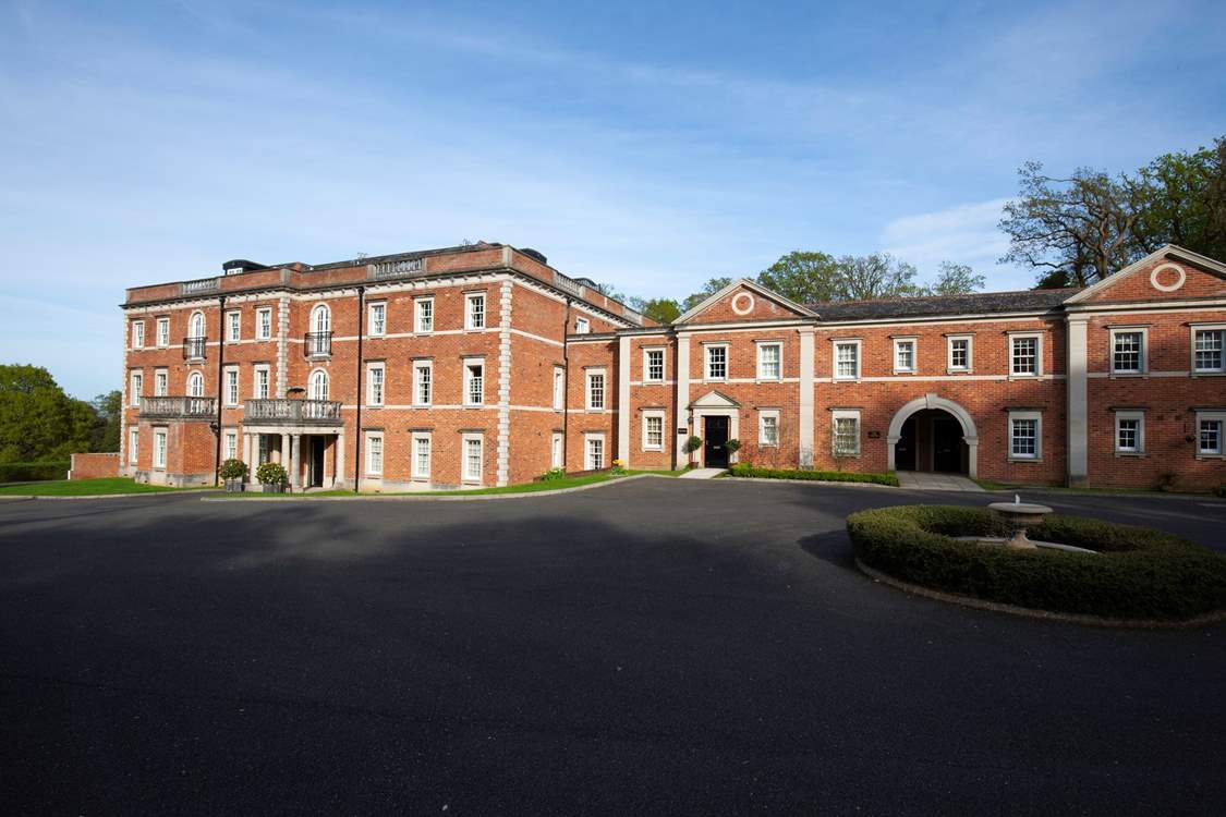 There is a large parking-area with allocated bays along one side of this impressive building.