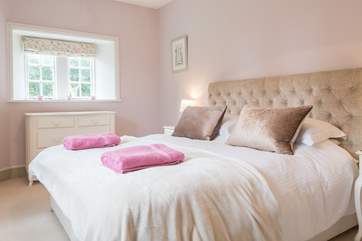 The master bedroom has a luxurious feel and is separated from the other first floor rooms.