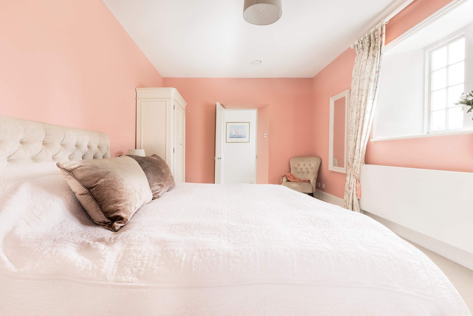 Relax and unwind in the pretty pink bedroom which has zip and link beds so you can choose either twins or a super-king double bed. 