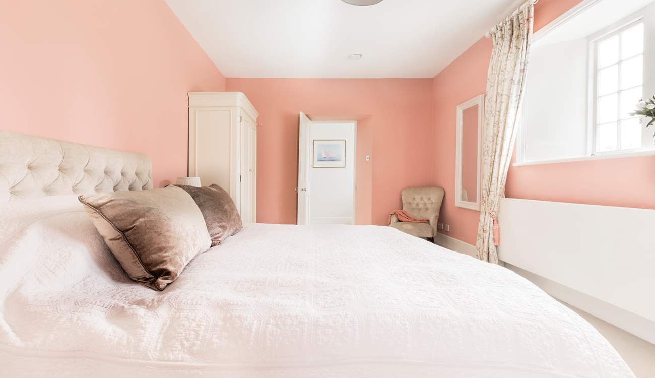 Relax and unwind in the pretty pink bedroom which has 'zip and link' beds so you can choose either twins or a super-king double bed. 