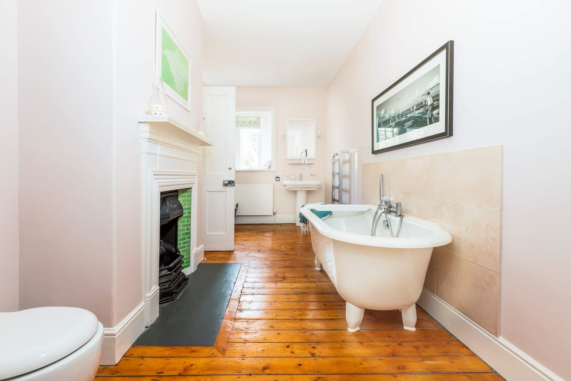 The gorgeous feature bathroom has a roll top bath, perfect for a long soak after a bus beach day. This Jack and Jill bathroom sits in between two bedrooms. 
