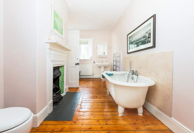 The gorgeous feature bathroom has a roll top bath, perfect for a long soak after a bus beach day. This Jack and Jill bathroom sits in between two bedrooms. 