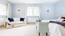 This beautiful room is decorated in calm pastel blue shades.