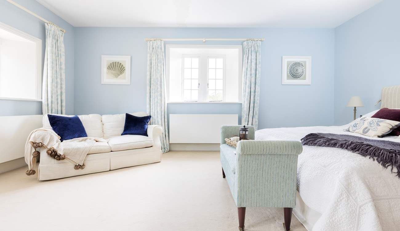 This beautiful room is decorated in calm pastel blue shades.