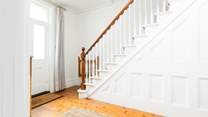 The staircase leads to the first floor bedrooms. 