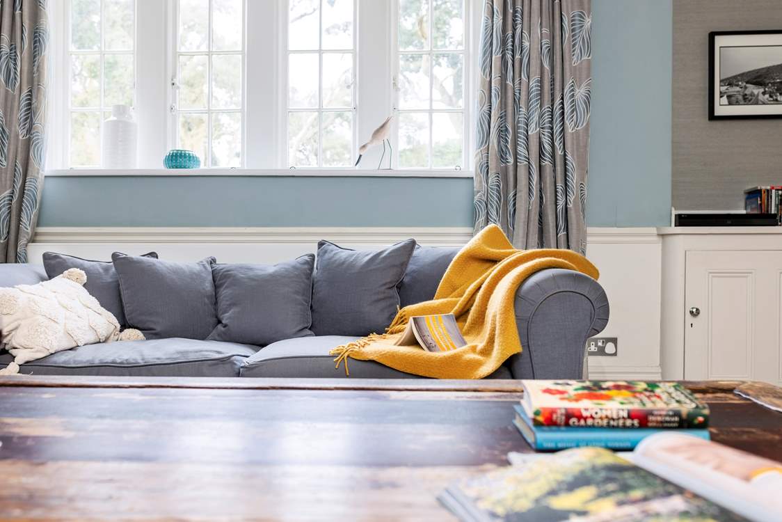 Relax on the sofa with a good holiday read.