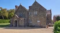 Barton Manor Farmhouse is part of the idyllic Barton Manor estate with a private beach just a 15 minute stroll away.