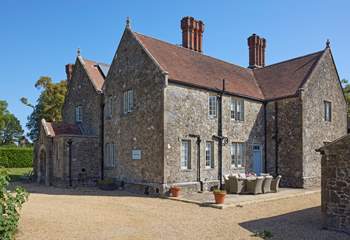 The gravelled driveway leads to the large parking area, to the front of Barton Manor Farmhouse.