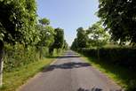 There is a long private driveway leading to the Farmhouse.