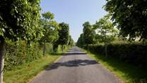There is a long private driveway leading to the Farmhouse.