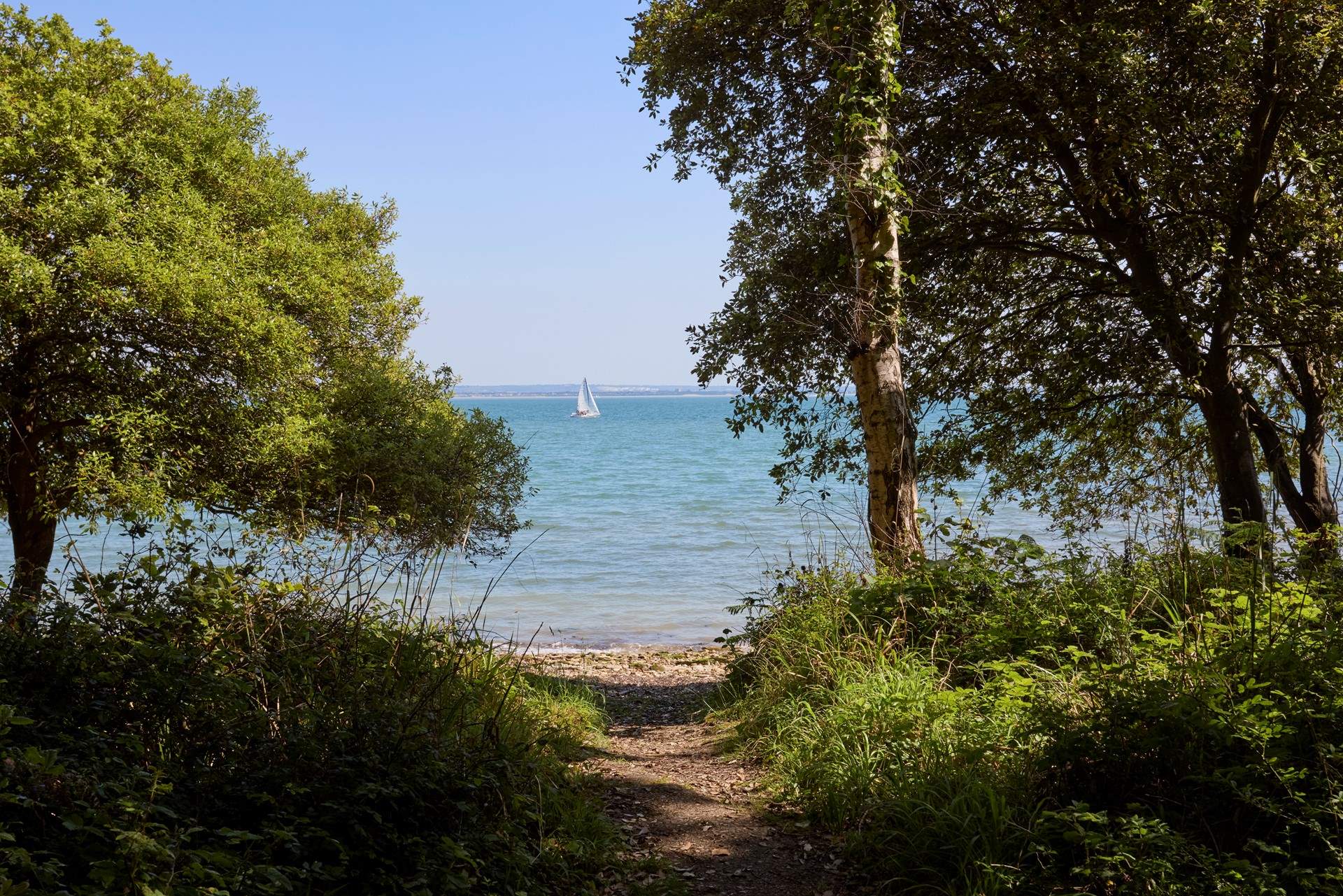 Walk through the woodlands to your very own beach.