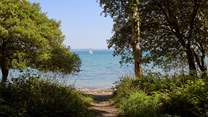 Walk through the woodlands to your very own beach.