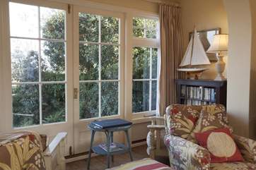 The doors open out to the sloping garden with views to envy.