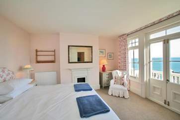The second bedroom on the first floor has doors out to the balcony.