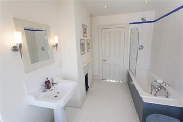 Second bathroom with a shower over the bath.