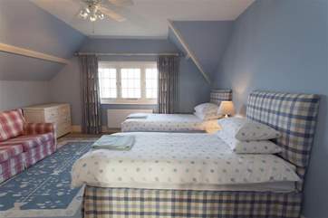 Second floor twin bedroom with views out to sea.