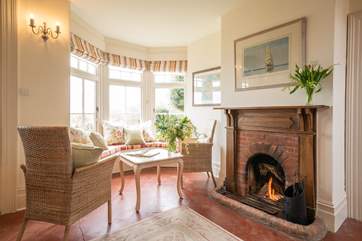 This relaxing spot is in the spacious hallway and has doors out to the garden.